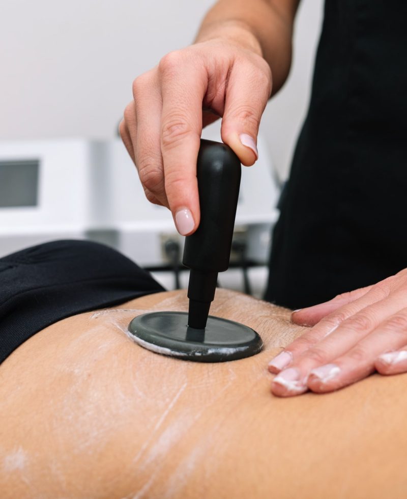 short-plane-beautician-giving-radio-frequency-treatment-woman-stomach-that-outlines-stimulates-healthy-cell-function